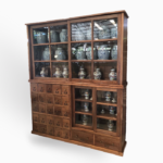 Display cabinet with 2 sections, 27 drawers, 4 sliding doors